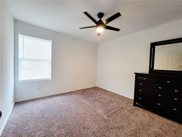 interior space with ceiling fan and carpet floors