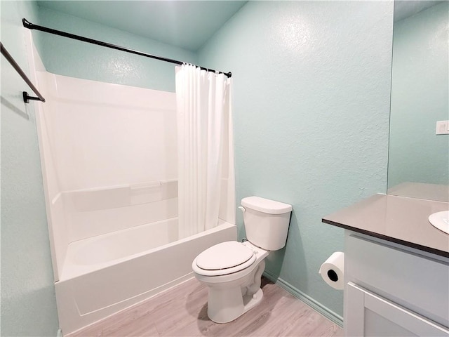 full bathroom with hardwood / wood-style floors, vanity, shower / bath combination with curtain, and toilet