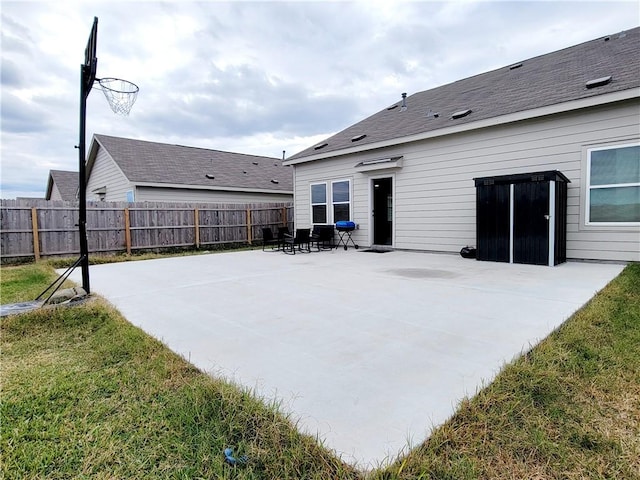 rear view of house with a yard and a patio area