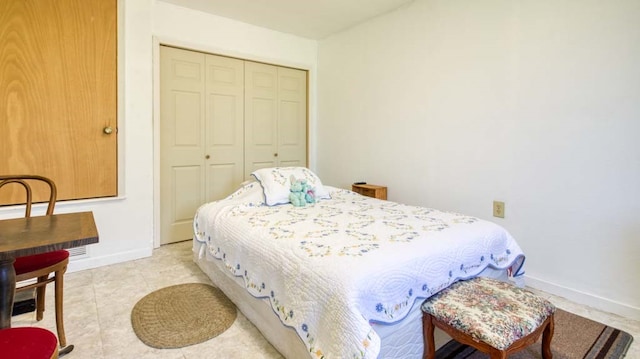 tiled bedroom featuring a closet