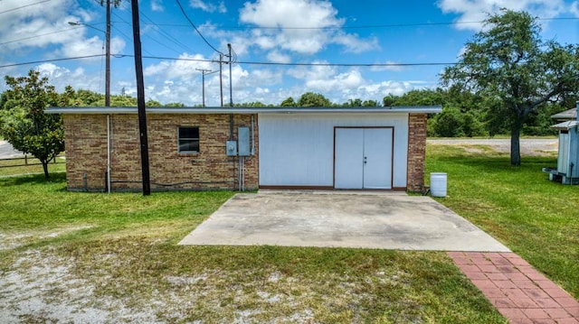 view of outbuilding with a yard