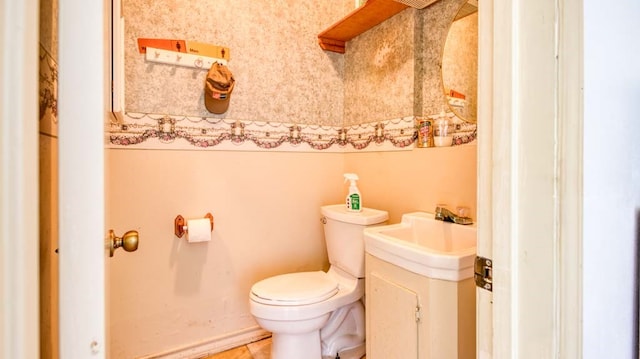 bathroom featuring toilet and sink