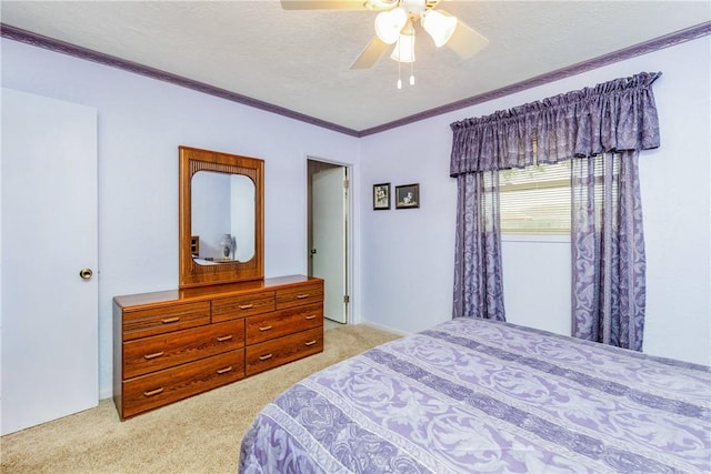 bedroom with a ceiling fan, crown molding, light colored carpet, and a textured ceiling