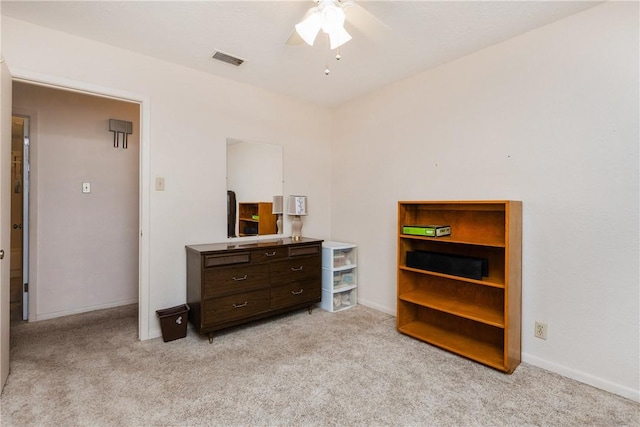 bedroom with ceiling fan, baseboards, visible vents, and light carpet