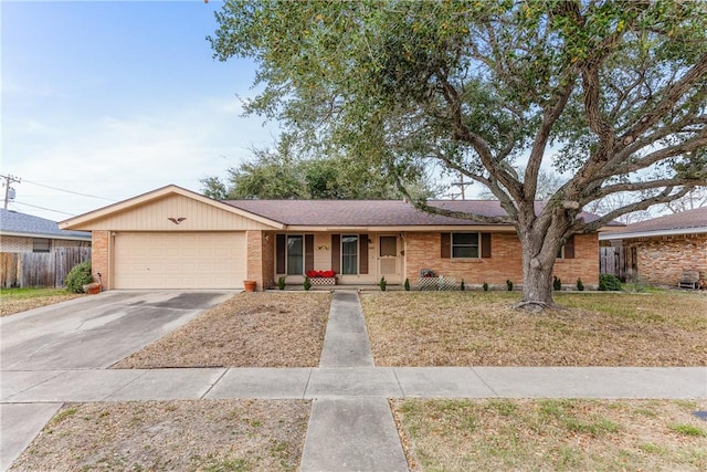 single story home with brick siding, a front lawn, fence, driveway, and an attached garage