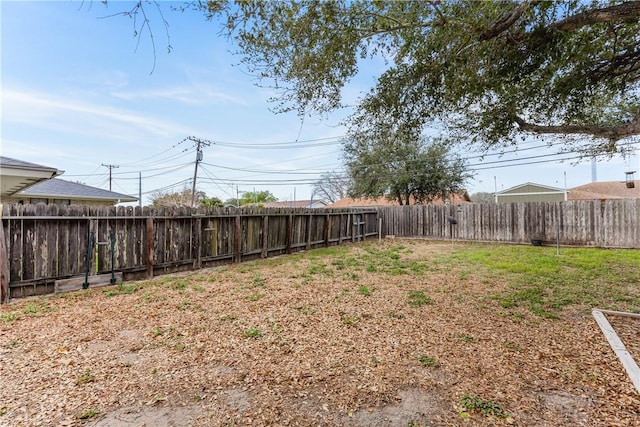 view of yard featuring a fenced backyard