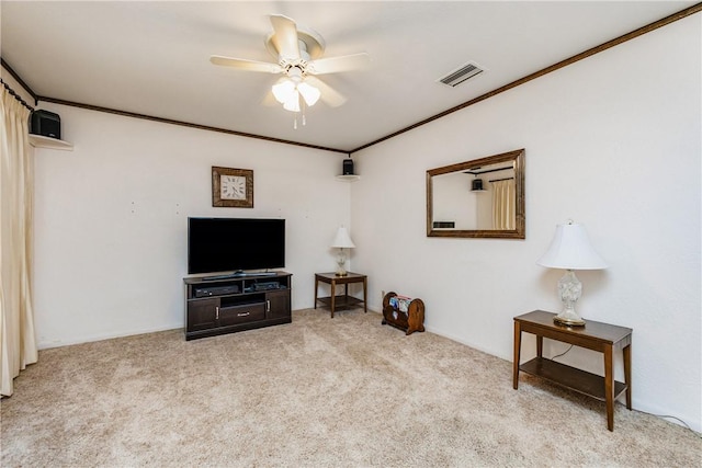 living area with visible vents, crown molding, a ceiling fan, and carpet floors