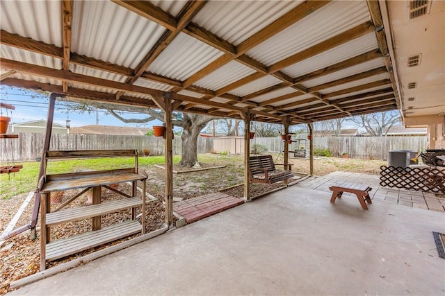 view of patio featuring cooling unit and a fenced backyard