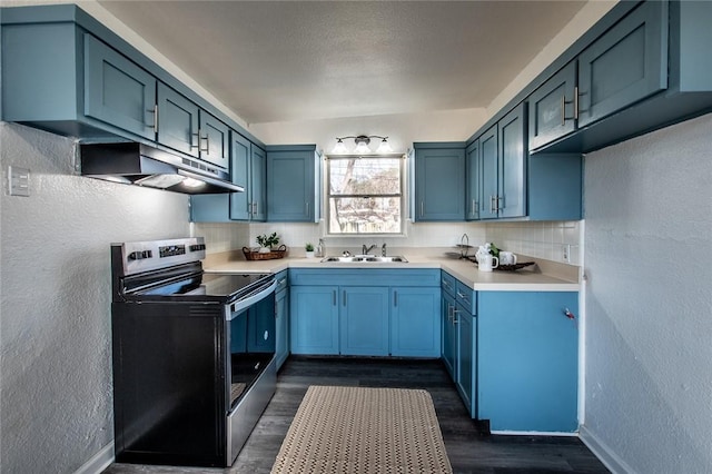 kitchen with stainless steel electric range oven, blue cabinets, tasteful backsplash, sink, and dark wood-type flooring