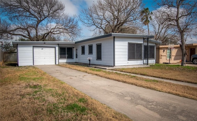 ranch-style house with a garage and a front yard