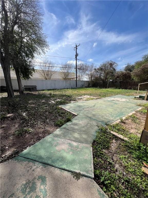 view of property's community featuring fence