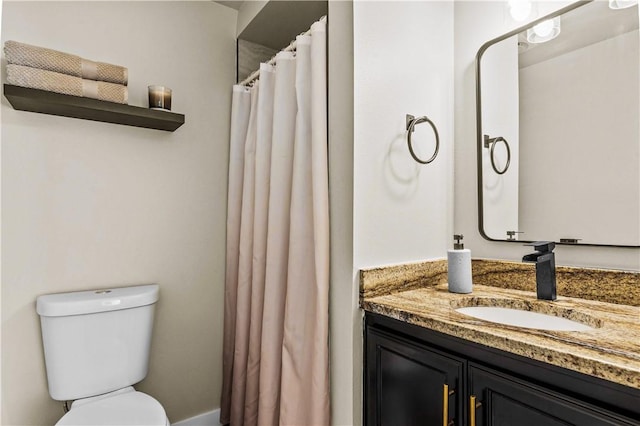 full bathroom featuring toilet and vanity