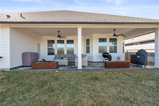 exterior space with an outdoor living space, a yard, ceiling fan, and a patio area