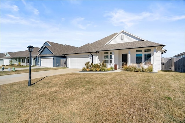 ranch-style home featuring a garage and a front lawn