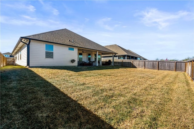 back of house featuring a yard