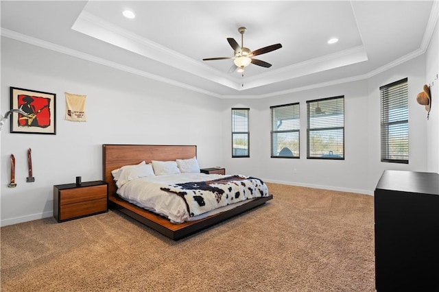 bedroom with crown molding, ceiling fan, a raised ceiling, and carpet floors