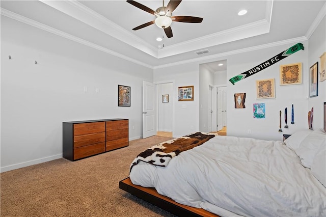 bedroom featuring crown molding, light colored carpet, a raised ceiling, and ceiling fan