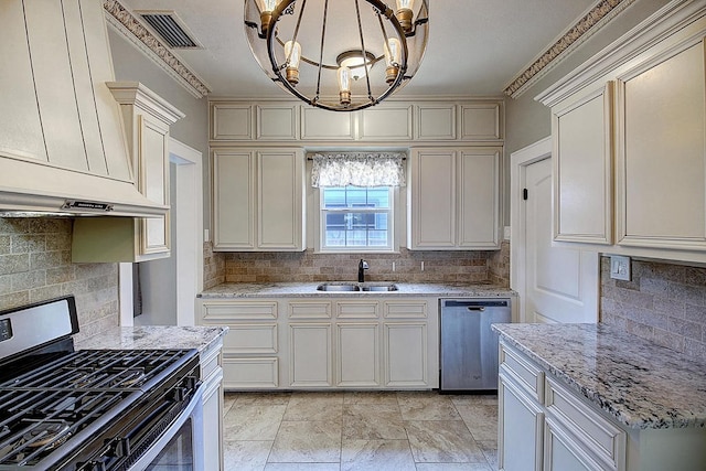 kitchen featuring decorative backsplash, hanging light fixtures, and appliances with stainless steel finishes