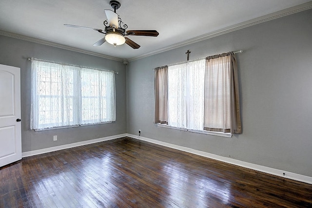 empty room with crown molding, ceiling fan, and dark wood-type flooring