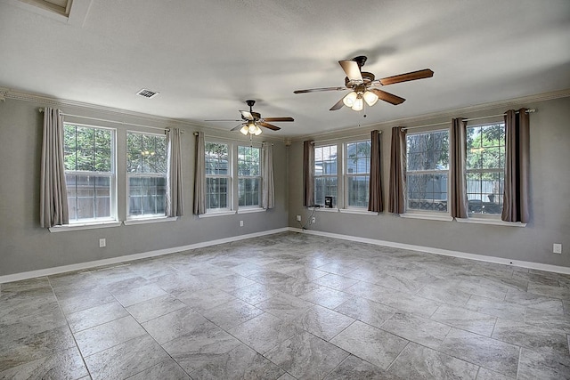 unfurnished room featuring plenty of natural light, ceiling fan, and crown molding