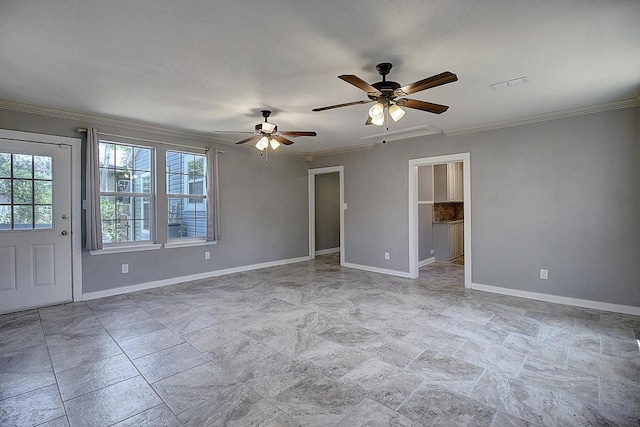 spare room featuring ceiling fan and ornamental molding