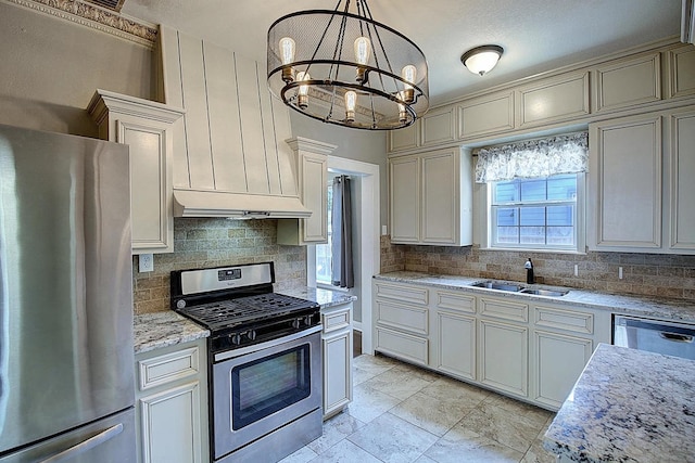 kitchen featuring exhaust hood, an inviting chandelier, sink, decorative light fixtures, and stainless steel appliances