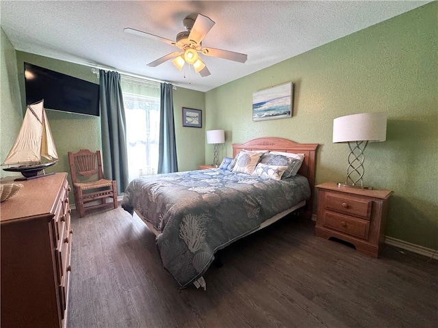 15125 Leeward Dr Unit 10, Corpus Christi, TX 78418 - bedroom featuring wood finished floors, a textured ceiling, a textured wall, and a ceiling fan