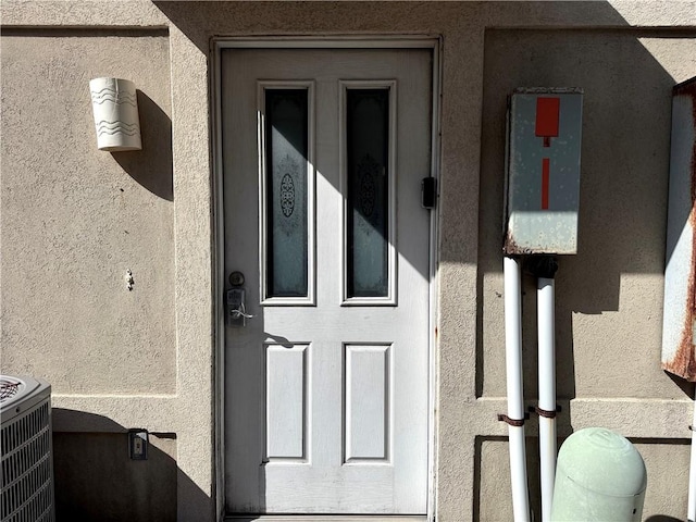 15125 Leeward Dr Unit 10, Corpus Christi, TX 78418 - doorway to property featuring stucco siding