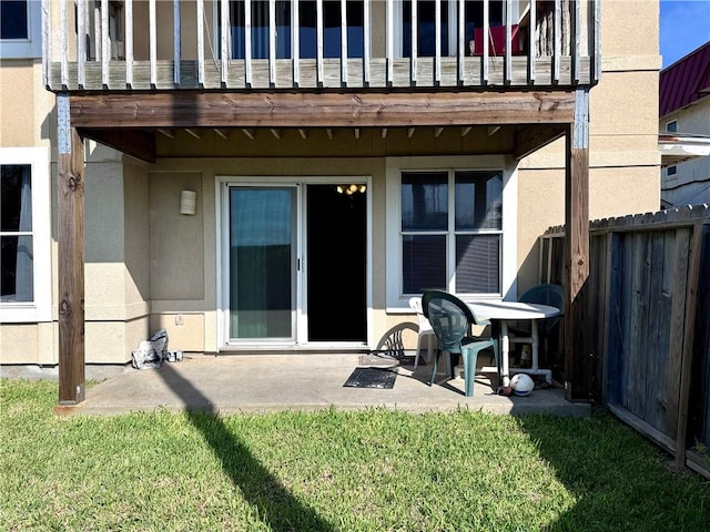 15125 Leeward Dr Unit 10, Corpus Christi, TX 78418 - back of house with stucco siding, a balcony, and a patio area