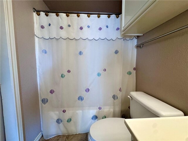 15125 Leeward Dr Unit 10, Corpus Christi, TX 78418 - bathroom featuring toilet and shower / bath combo