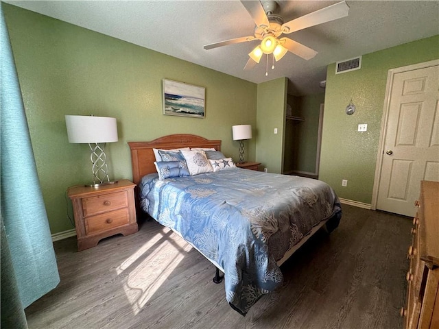 15125 Leeward Dr Unit 10, Corpus Christi, TX 78418 - bedroom featuring wood finished floors, a textured wall, and ceiling fan
