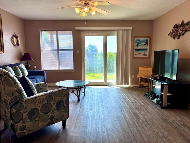 15125 Leeward Dr Unit 10, Corpus Christi, TX 78418 - living room with wood finished floors and a ceiling fan