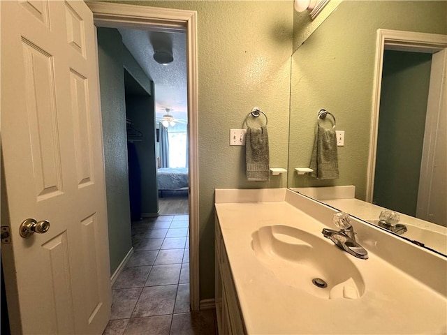 15125 Leeward Dr Unit 10, Corpus Christi, TX 78418 - ensuite bathroom with tile patterned floors, vanity, and a textured wall