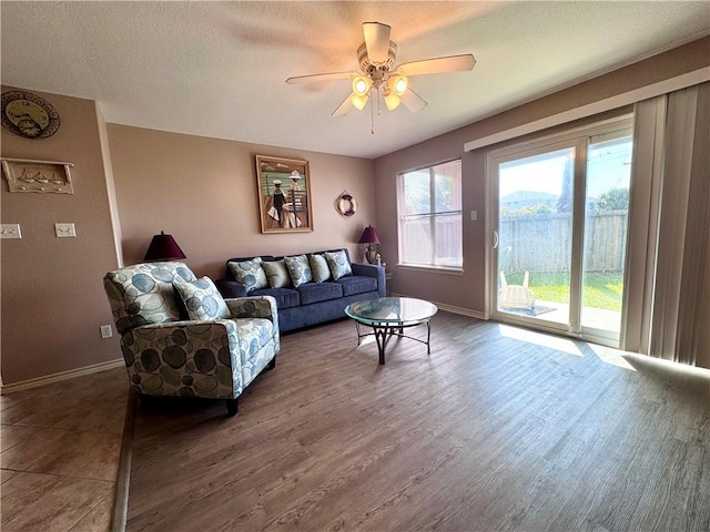 15125 Leeward Dr Unit 10, Corpus Christi, TX 78418 - living room featuring ceiling fan, wood finished floors, and a textured ceiling