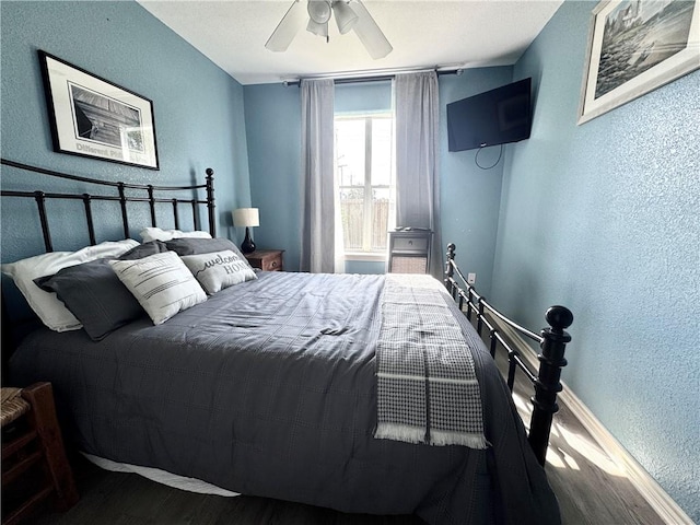 15125 Leeward Dr Unit 10, Corpus Christi, TX 78418 - bedroom featuring a textured wall, wood finished floors, and ceiling fan