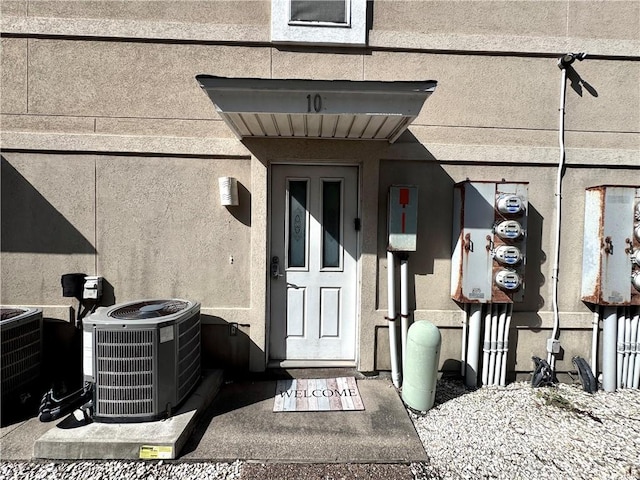 15125 Leeward Dr Unit 10, Corpus Christi, TX 78418 - doorway to property with stucco siding