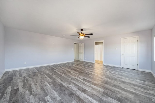 empty room with hardwood / wood-style flooring and ceiling fan