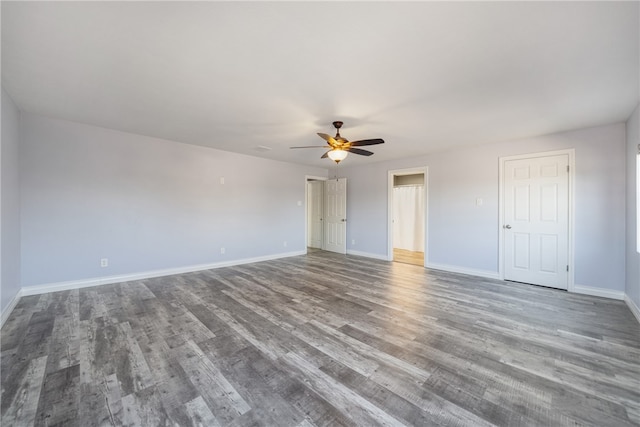 spare room featuring hardwood / wood-style floors and ceiling fan