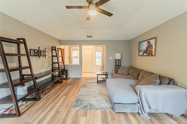 living room with ceiling fan and hardwood / wood-style floors