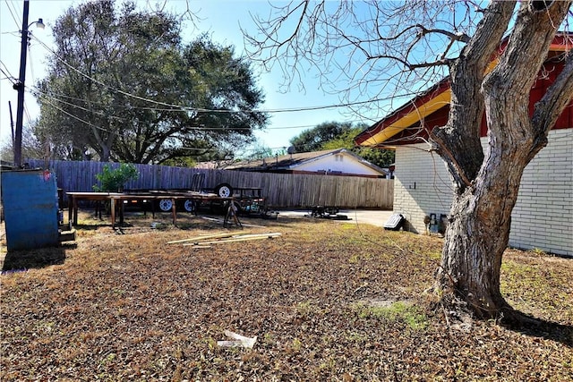 view of yard with a fenced backyard