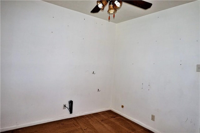 unfurnished room featuring baseboards and a ceiling fan