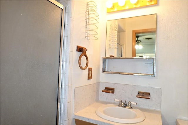 full bath featuring vanity and a shower with shower door