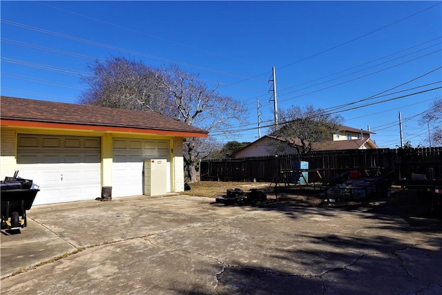 garage featuring fence