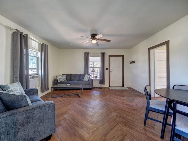 living room with ceiling fan, cooling unit, and parquet flooring