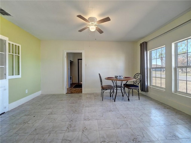 dining area with ceiling fan