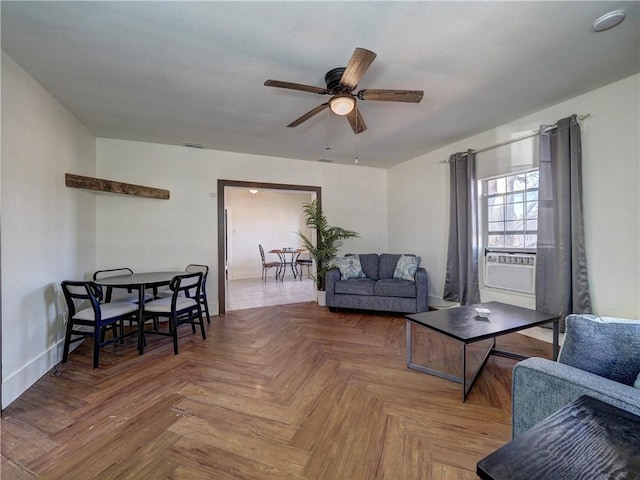 living room with ceiling fan, cooling unit, and parquet flooring