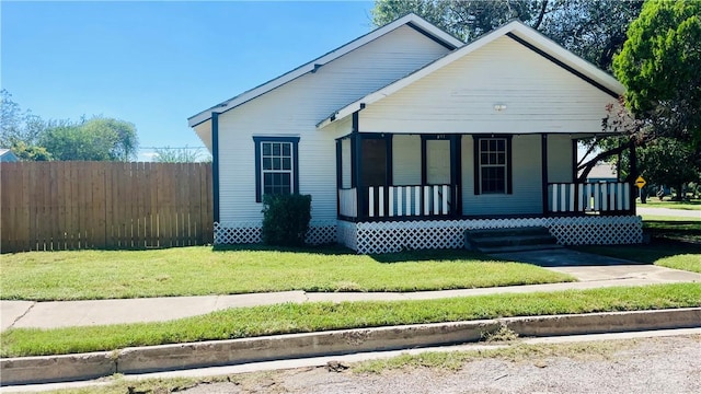 bungalow-style home with a porch and a front lawn