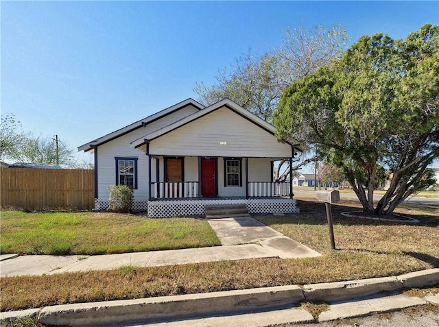 view of front facade with a porch and a front yard