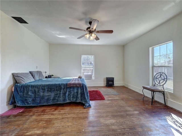 bedroom featuring dark hardwood / wood-style flooring and ceiling fan