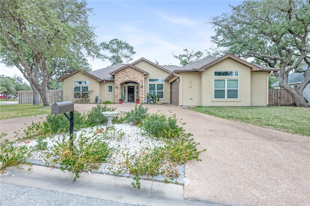 ranch-style home with a garage and a front yard